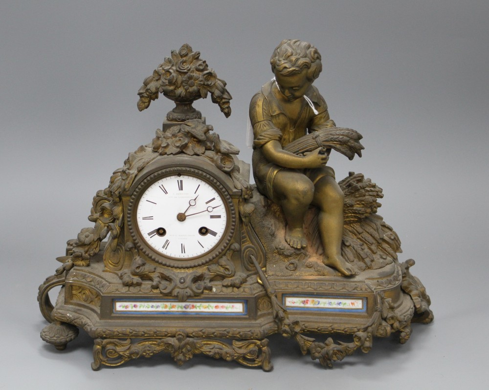 A late 19th century French ormolu mantel clock, with enamelled dial signed C. Detouche... Paris, height 28cm, width 36cm